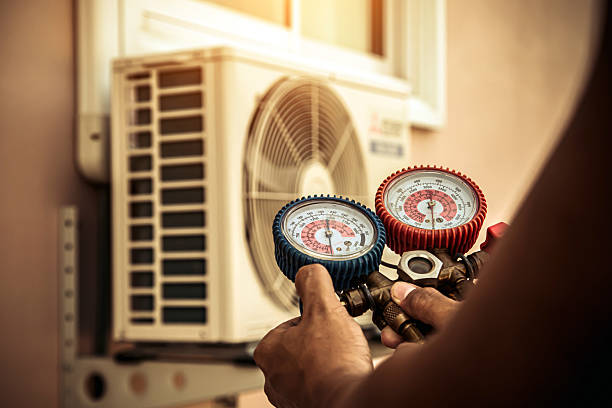 Professional Air Conditioning Service technician working in Laconia, IN